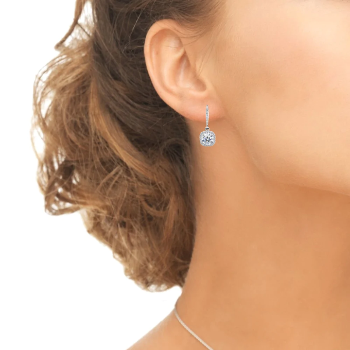0.5ct Round Moissanite Cushion Halo Drop Earrings (modelled).jpg 0.5ct Round Moissanite Cushion Halo Drop Earrings (modelled)