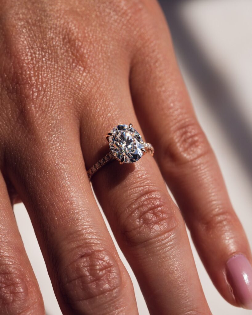 3ct Oval Cut Moissanite Hidden Halo Ring 3 Qtr Pave Band (4) 3ct Oval Cut Moissanite Hidden Halo Ring 3 Qtr Pave Band