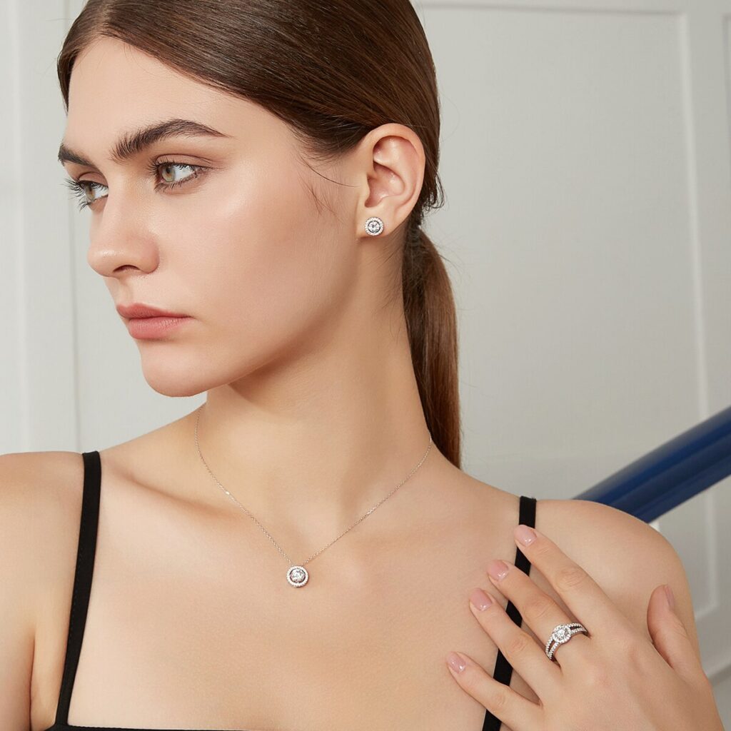 Round Moissanite Halo Stud Earrings (10) Round Moissanite Halo Stud Earrings Modelled