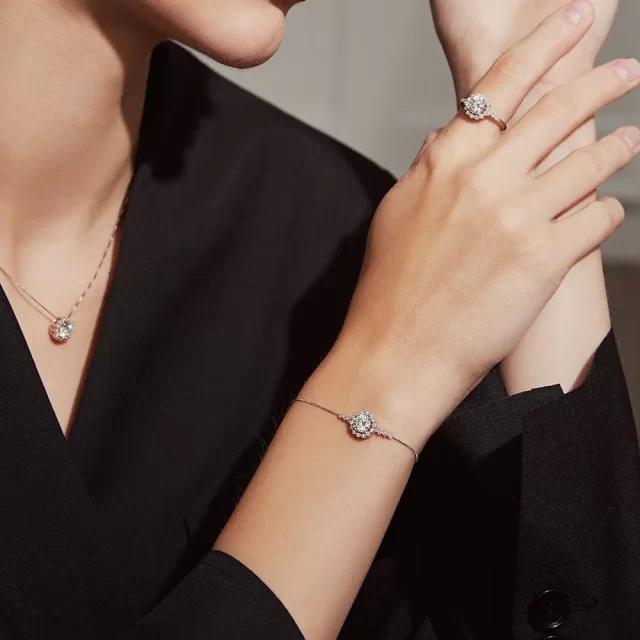 Flower Halo Round Moissanite Solitaire Bracelet Modelled Flower Halo Round Moissanite Solitaire Bracelet Modelled