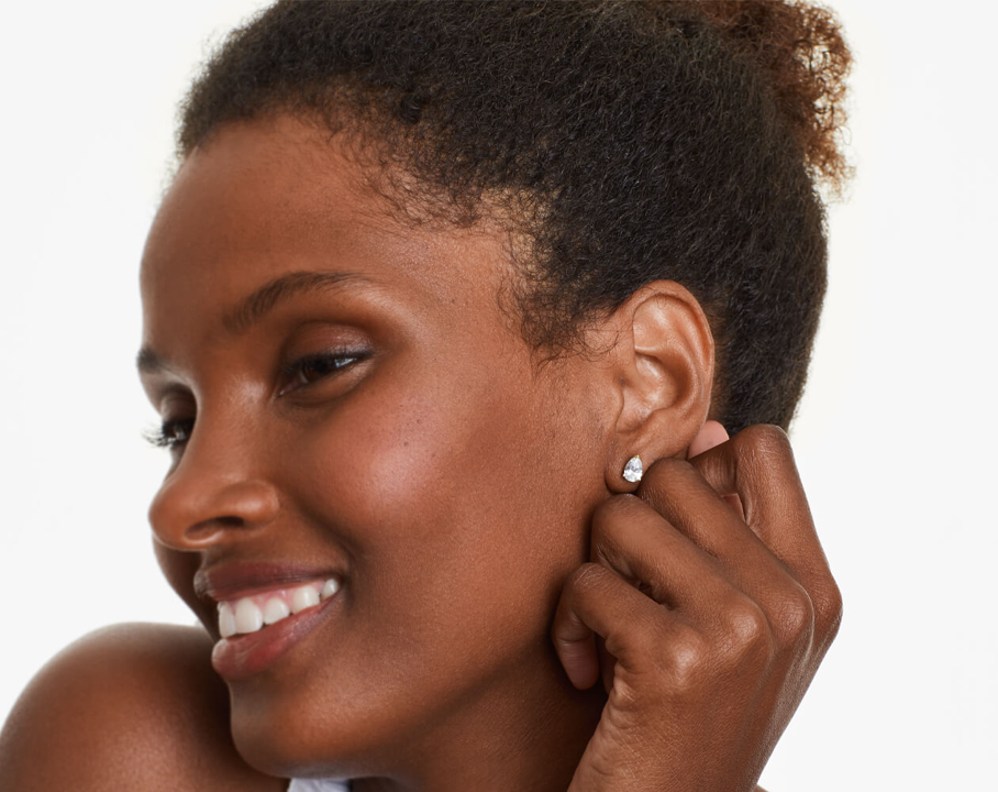 1ct Pear Cut Moissanite Solitaire Stud Earrings Modelled 1ct Pear Cut Moissanite Solitaire Stud Earrings Modelled