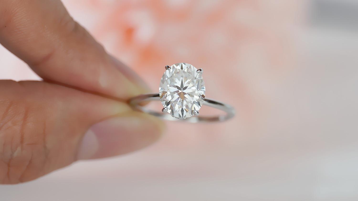 3 carat modern oval hidden halo ring (3) 3 carat modern oval hidden halo ring