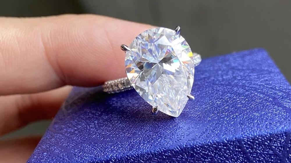 10ct Pear Moissanite Solitaire Ring with Pave Band (1) Pear Moissanite Solitaire Ring