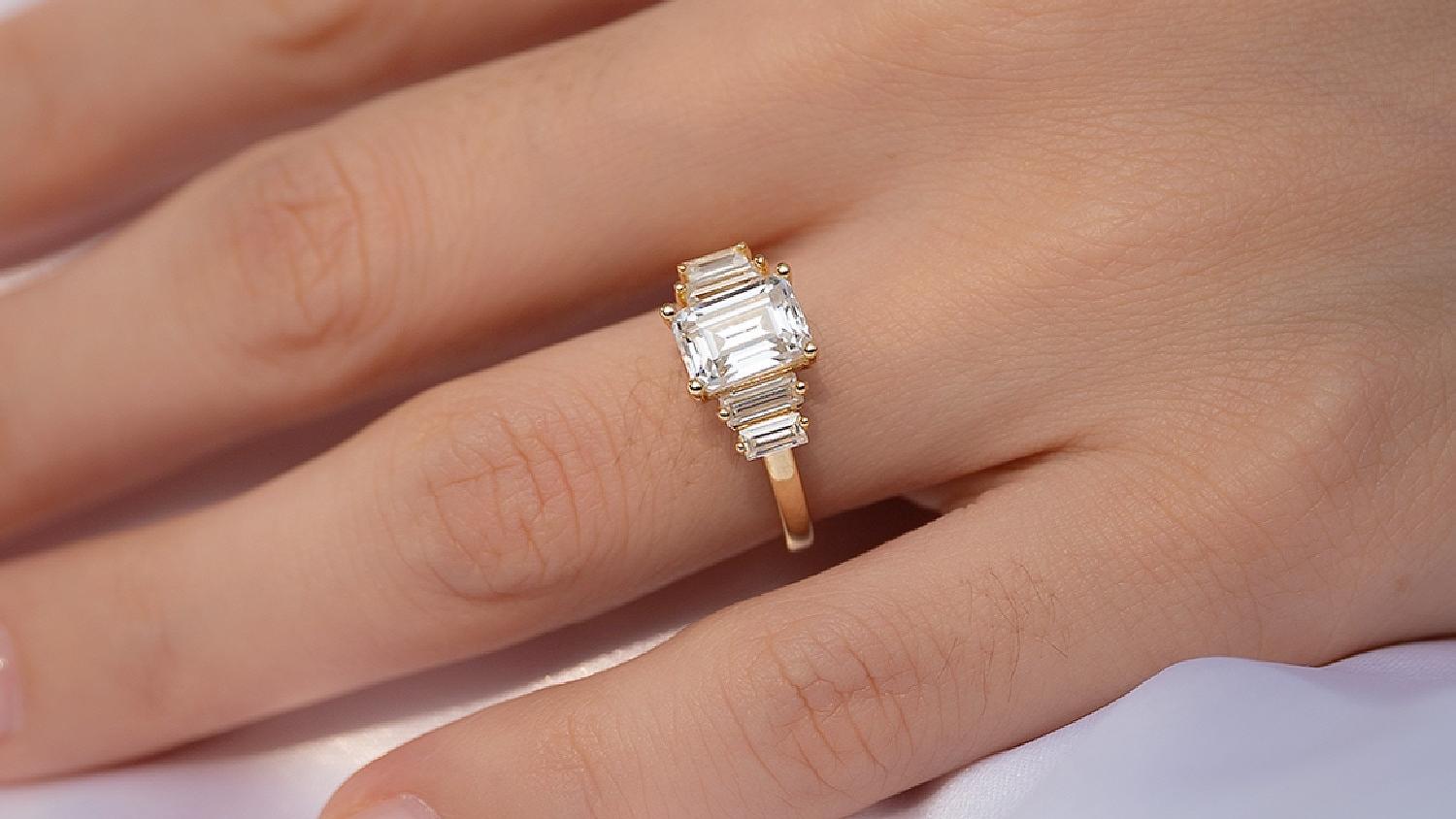 2ct Emerald Cut Side Baguettes Moissanite Ring (1) 2ct Emerald Cut Side Baguettes Moissanite Ring