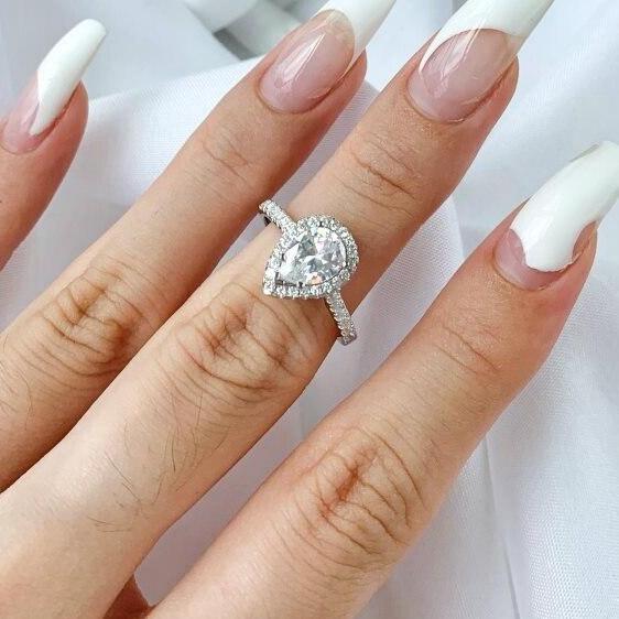 ‘Penelope SS’ 1 or 2 Carat Pear Cut Halo Moissanite Ring in Cathedral Setting 'Penelope SS' 1 or 2 Carat Pear Cut Halo Moissanite Ring in Cathedral Setting