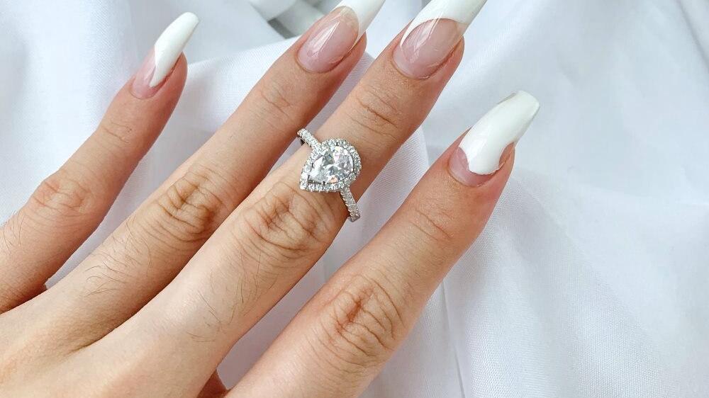 Pear Cut Halo Moissanite Ring (1) Pear Cut Halo Moissanite Ring