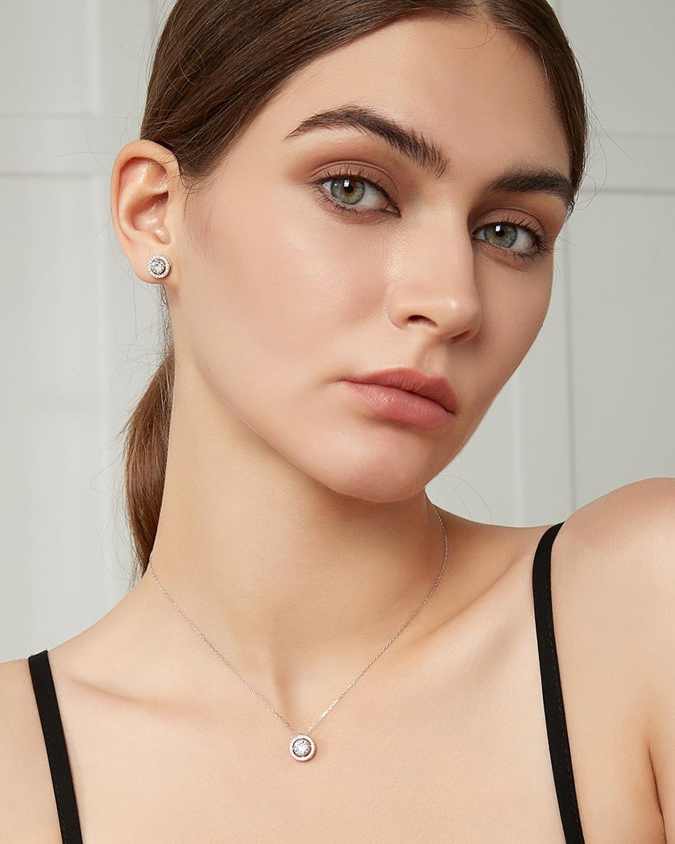 Round Moissanite Halo Stud Earrings (2) Round Moissanite Halo Stud Earrings Modelled