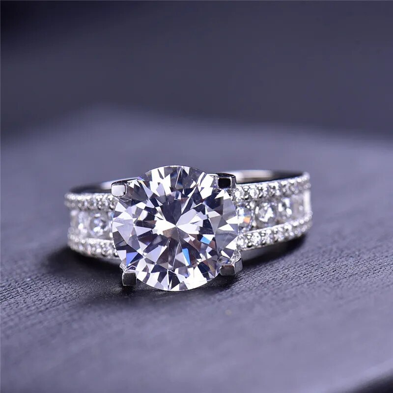 Helen Round Moissanite 4 Prong Tension Ring with Channel Band Front Helen Round Moissanite 4 Prong Tension Ring with Channel Band