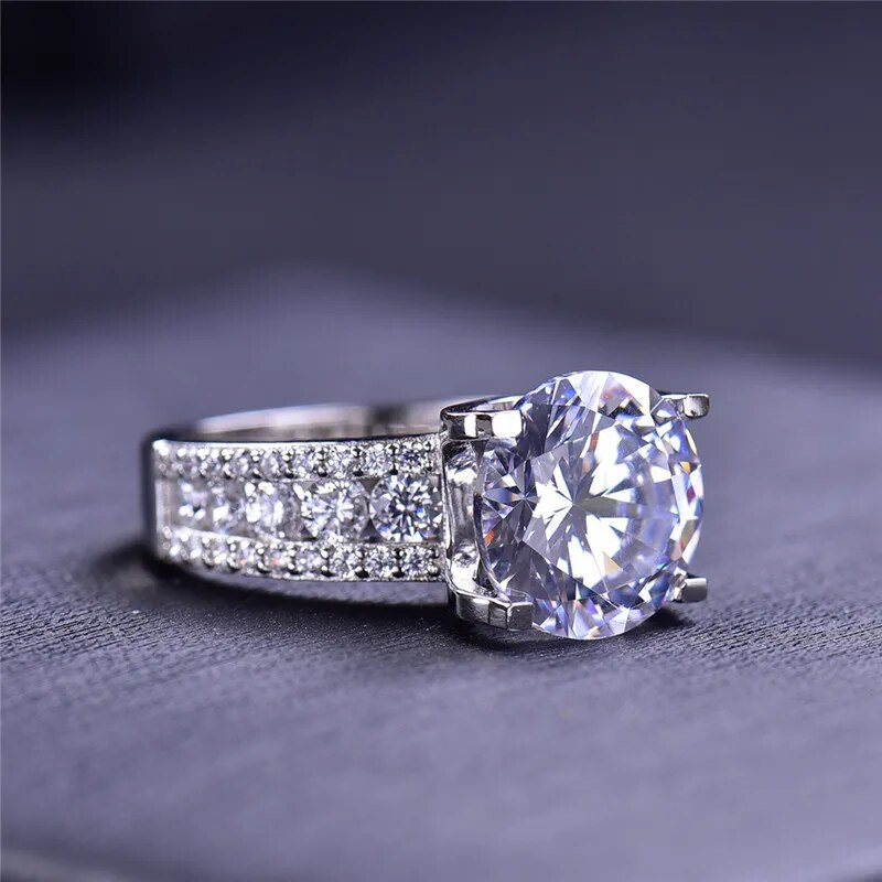 Helen Round Moissanite 4 Prong Tension Ring with Channel Band Slight Side Helen Round Moissanite 4 Prong Tension Ring with Channel Band